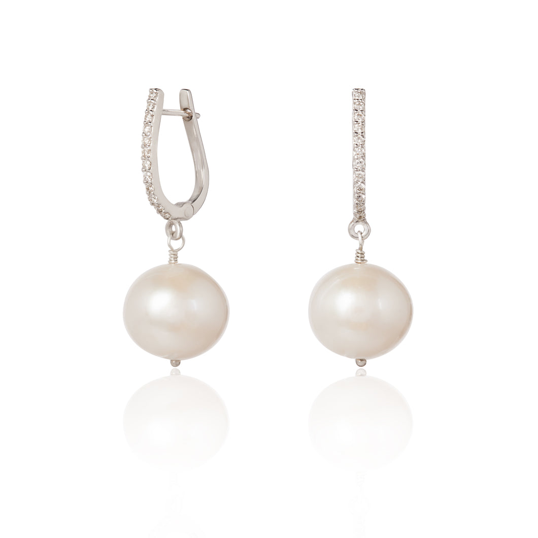Diamond studded dangly earrings with white Pearls drops